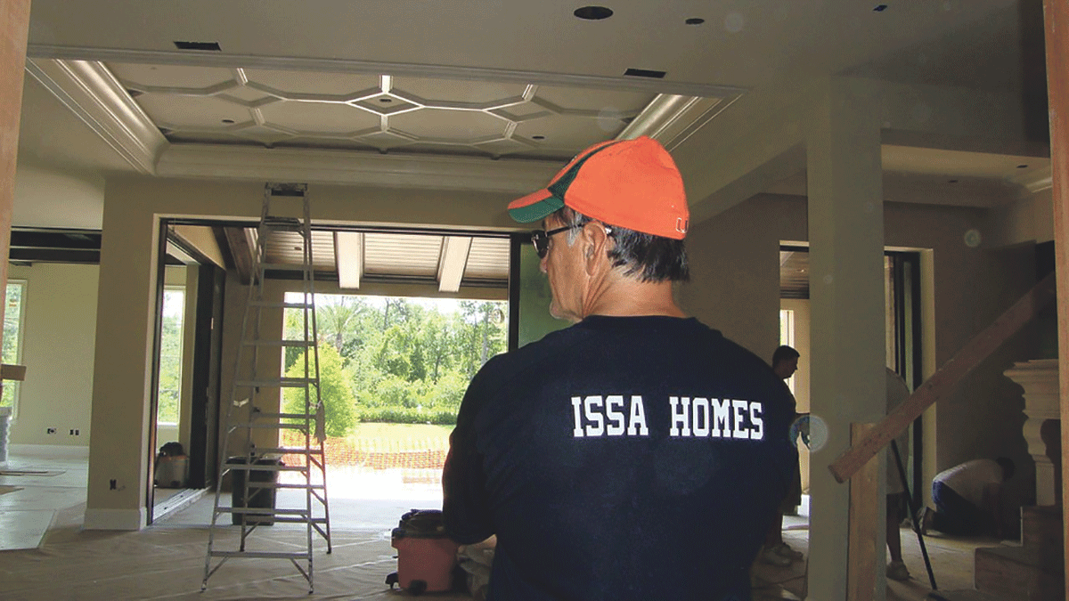 Don wearing Issa Homes shirt